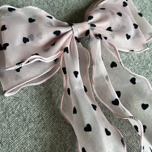 pink sheer bow with black hearts, hair clip. (Black hearts feel like velvet)